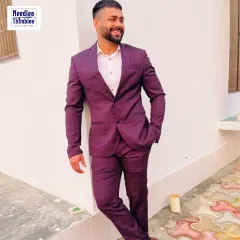 This is what a perfect fit looks like. Our client is wearing a custom-tailored maroon plaid two-piece suit, ideal for both business meetings and evening events. We worked with him to select the fabric and cut for a modern, confident style.