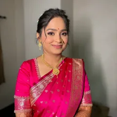 A smiling portrait of the engagement bride. The makeup is kept fresh and radiant to highlight her natural beauty and happiness.