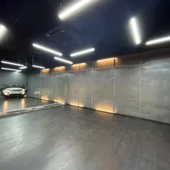 Another one of our studio spaces, designed for shoots and rehearsals. This unique setup, complete with a car prop, is available for creating cinematic pre-wedding videos or concept-based dance performances.