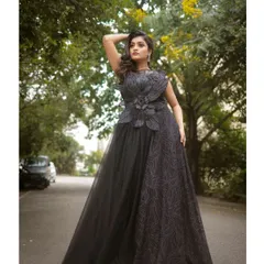 For a touch of dark romance, this black evening gown is an absolute showstopper. Its intricate design and flowing silhouette are perfect for creating dramatic and high-fashion pre-wedding photos.