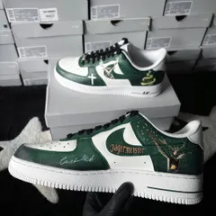 A side-by-side view of the Jägermeister custom sneakers, held to display the outer design. The iconic Jägermeister logo and signature green are hand-painted with scratch-resistant, durable paint.
