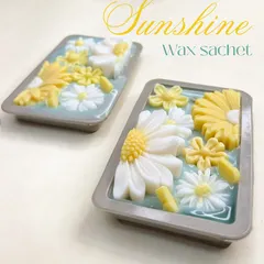 Meet 'Sunshine', my jasmine-fragranced floral wax sachet. This image shows two sachets, highlighting the intricate daisy and sunflower designs that bring a cheerful, refreshing vibe.