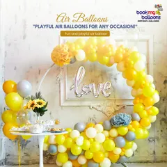 This sunny yellow and grey balloon circle is a beautiful and modern piece of decor. It features a "love" foil balloon in the center, making it a lovely backdrop for a bridal shower, engagement party, or anniversary.