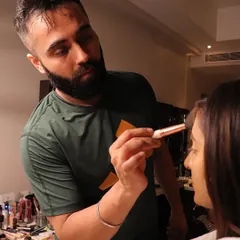 A "kaam wali photu." This is me in my element, surrounded by my tools, ready to create some makeup magic.