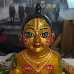 A close-up of the 'after' result. I repainted the face with delicate details like lotus flowers and peacock feathers to give it a divine look.