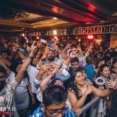 A sea of happy faces and phones in the air at a New Year's Eve event at the Taj MG Road. This is the kind of energy I bring to every major celebration.