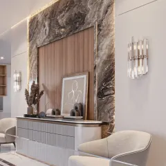 Detail of a console unit in the drawing room. The dramatic marble slab is framed by wood paneling, creating a sophisticated backdrop for curated art and decor.