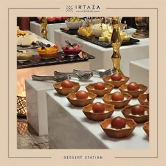A view of our dessert station, showcasing the variety we offer. Here you can see our Gulab Jamun bowls alongside a selection of dips and cheeses.