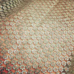 An example of the beautiful fabrics I source for my collection. This is an all-over floral sequin net, which creates a dazzling effect for evening wear.