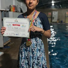 Our girl Pihu with her gold medal for the 50m breaststroke at Talkatora stadium. Her victory is a testament to her consistent effort and training.