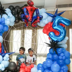 The birthday boys posing inside their very own Spider-Man web. I love creating interactive elements that make the party even more fun.