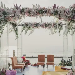For this beachside wedding, the view was the star. I designed a minimalist, transparent mandap with a floating floral canopy, ensuring the ocean remained the breathtaking backdrop for the ceremony.