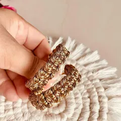 Holding up the golden hoops. They catch the light so beautifully and are perfect for parties or weddings.
