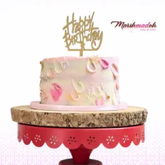 A Neapolitan cake with alternating layers of rich chocolate, sweet strawberry, and classic vanilla. The exterior is decorated with a soft, abstract buttercream design for an elegant finish.