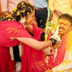 The playful battle of Haldi. It's these fun, unscripted moments between the bride and groom that make for the most memorable photos.