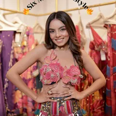 A snapshot from my 'Six Months in Style' recap. This photo captures my personality and love for fashion, taken during a fun moment at a designer's studio filled with colorful outfits.