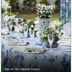 For me, elegance is in the details. This seated dinner setup features fine blue and white patterned linens, crystal glassware, and fresh floral centerpieces, creating a sophisticated atmosphere for an alfresco event.
