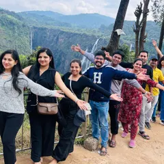 Our group having fun with a pose in front of the magnificent Jog Falls, often a stop on our way to the coast. The sheer size of the falls is awe inspiring.