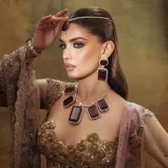 A side profile of this dreamy, editorial look. The makeup is designed to be dramatic and captivating.