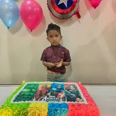 Assemble the heroes for a birthday celebration with this Avengers photo cake. The colorful buttercream border frames an edible image of Iron Man, Captain America, and the Hulk, perfect for a young superhero fan.
