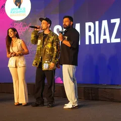 A candid moment on stage at the GCL event. As an emcee for entertainment leagues, I maintain a high level of energy and engagement, guiding the audience's attention and making sure the event is as exciting as the sport itself.