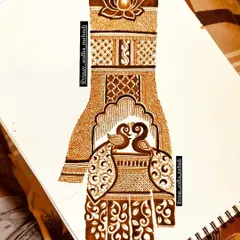A design sketch for a back-of-hand mehndi with two lovebirds under a jharokha. This is how I bring a client's romantic vision to life.