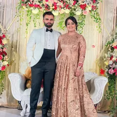 A beautiful couple ready for their reception. I created a sophisticated evening look for the bride with a classic updo and shimmering makeup that complemented her ornate gown.