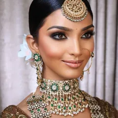 A stunning look created for my online class, demonstrating manual makeup techniques for deep Indian skin. The goal is to achieve a flawless, glowing finish that celebrates the richness of the complexion without looking ashy.