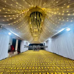 Ceiling decor can completely transform a space. Here, I used flowing white drapes, thousands of fairy lights, and a central floral chandelier to create a magical, starry night effect for an indoor event.