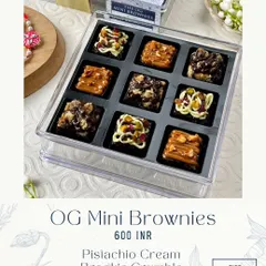 A box of my OG Mini Brownies, featuring an assortment of flavors like Pistachio Cream, Brookie Crumble, and Caramel Sea Salt. Each one is a fudgy, bite-sized delight.