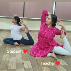 A lovely moment of a student and teacher practicing a variation of Rajakapotasana (Pigeon Pose) side-by-side. I guide students of all ages to find their own expression of a pose.
