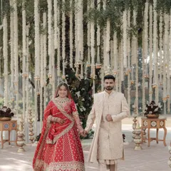 The walk to forever. This shot captures the couple hand in hand, walking through a beautifully decorated aisle, symbolizing the start of their new journey.