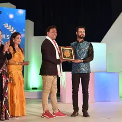 Receiving an award on stage at the Grand Northeast 2021. I am grateful for the support and recognition from my community.