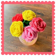 A beautiful bouquet of my handmade crochet roses in a decorative vase. This arrangement shows how you can mix and match colors for a vibrant display that brightens up any space permanently.