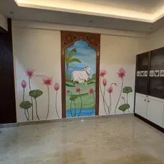 This view shows how the Pichwai mural becomes a major feature in the living room. It combines multiple art forms: Archiconcrete texture, lippan art, and traditional painting, to create a unique and culturally rich statement.