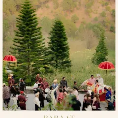 A stunning wide-angle shot of the Baraat procession in the hills, capturing the scale and beauty of a destination wedding celebration.