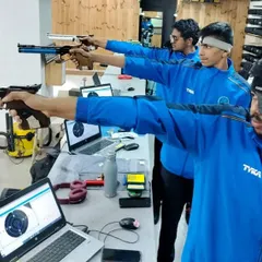 Precision in practice. My shooters train with modern air pistols, and each lane is equipped with a laptop displaying real-time results from our electronic target systems, allowing for instant feedback and analysis.