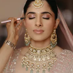 Creating the perfect eye look involves careful layering and blending. This shot shows the application of a winged liner, a technique I cover in-depth to help you achieve precision.