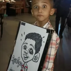 Look at that expression. This young man was thrilled with his caricature at Nincasa restaurant in Pune. I love drawing for kids and seeing their excited reactions.