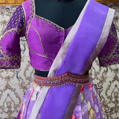 A closer view of the lavender half saree, highlighting the detailed embroidery on the blouse and the delicate fabric of the organza dupatta.
