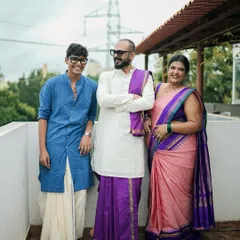 A family that celebrates together, should shine together. I designed these coordinated outfits for my wedding day, a custom pink and purple saree look for me, and matching traditional wear for my husband and son. I create bespoke outfits for the entire family for any occasion.