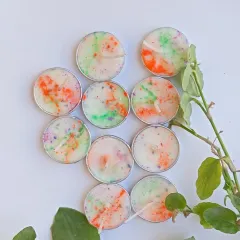 Another arrangement of my Holi-themed tealights, showing the unique color patterns on each one. They are hand-poured with love to add a glow to your celebrations.
