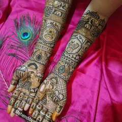 The complete view of this narrative bridal mehndi, showcasing the symmetry and detailed storytelling on both arms.