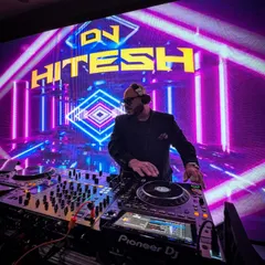 In the zone, surrounded by lights, with a packed dance floor ahead. This is my happy place, where I turn your wedding playlist into an unforgettable live experience.