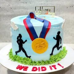 A cake for a runner couple celebrating their 25th anniversary. The design features their silhouettes and a gold medal, celebrating their shared passion and milestone.
