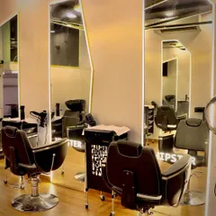 Our styling area features full-length, backlit mirrors and professional-grade chairs to ensure you have the best experience. The clean, contemporary design reflects the quality and care we put into all our services.