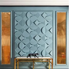 This entryway features a striking 3D wall panel with a geometric pattern. Paired with fluted glass panels and a minimalist console table, it creates a sophisticated first impression.
