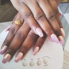 You can never go wrong with a beautiful chrome finish. Here, I've applied a stunning iridescent pink chrome powder over coffin-shaped gel extensions. The way it catches the light is just amazing, and it’s all cured perfectly under my portable UV lamp.