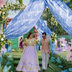 A sweet summer afternoon for a Mehendi, full of love and laughter. The bride's pastel lehenga was the inspiration for this dreamy makeup look with a pop of pink on the eyes.