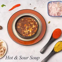 Our Hot & Sour Soup is a perfect balance of spicy and tangy flavours. It's a comforting and flavourful soup to start your meal.